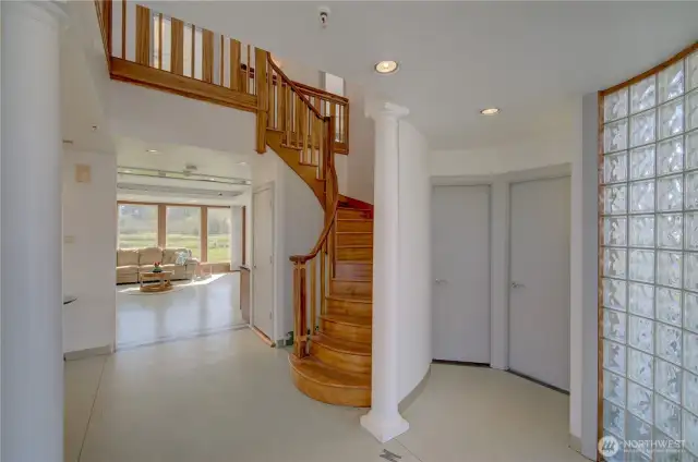 Main floor entry looking into the living room and stairway to the 2nd floor.