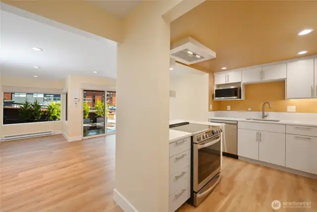 Kitchen looking to the East. Completely renovated with new cabinets, appliances and flooring in 2021.
