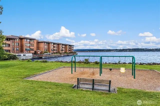 Madison Park North Beach playground near South side of Building A looking East across the Lake. Bus Stop on other side of 43rd Ave E for Route 11.