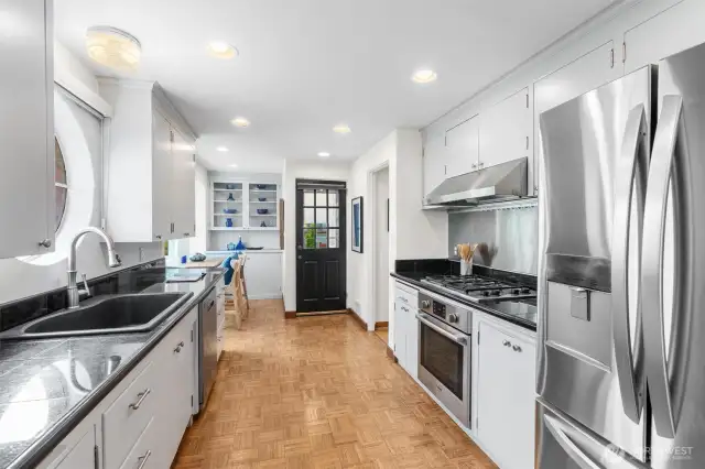 Modern Kitchen w/ Breakfast nook and easy access to large fenced in yard with patio