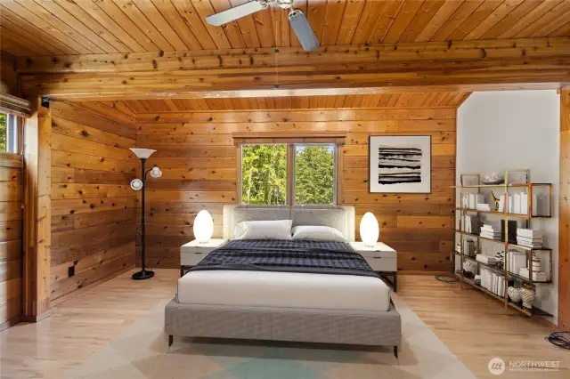 One of two bedrooms on the main floor of the main home. This room was previously used as a media room. This has been virtually staged.
