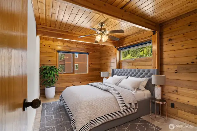 One of two bedrooms on the main floor of main home. This has been virtually staged.