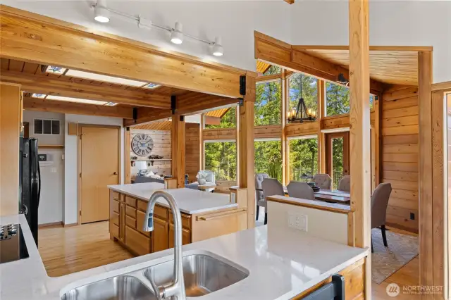 New quartz countertops add a fresh, bright touch to this open-concept kitchen.