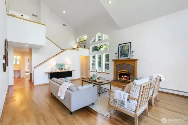 Great room is anchored by a toasty propane fireplace, and would look magnificent with a towering Christmas tree!
