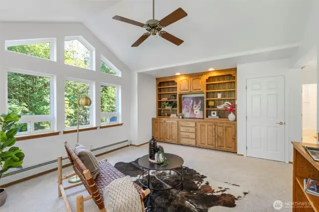 Upper level loft is ideal for a home office, gym, or family room.