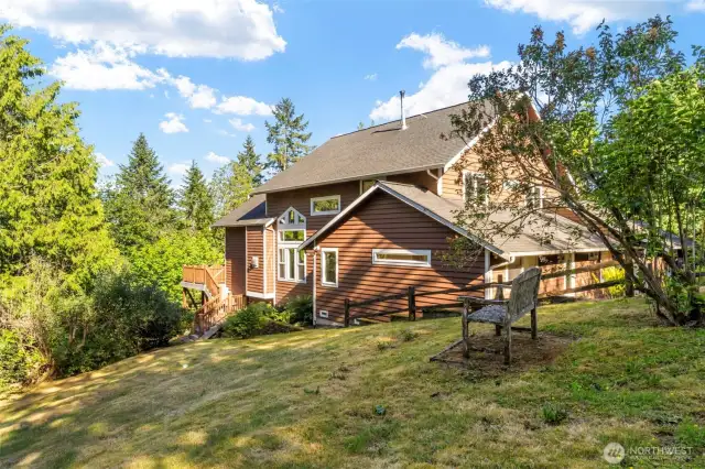Close to amenities, yet surrounded by enough property and stately evergreens to create privacy.