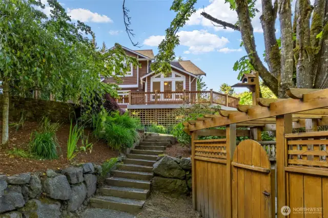 Immaculately maintained, with cedar siding, easy care composite decking, and established landscaping.