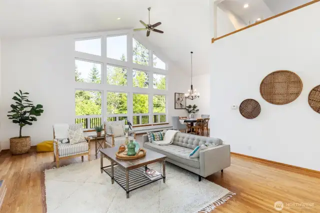 Soaring vaulted ceilings, and walls of windows showcase the surrounding natural beauty.