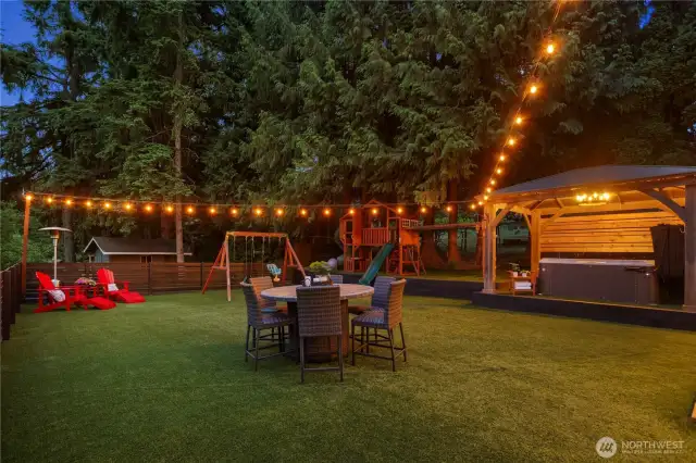 Level Fenced Cloud 9 Turf Space. Playsets and Hot tub