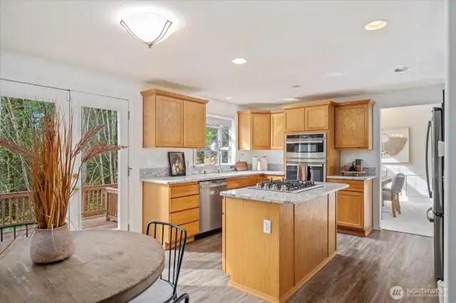 Continuous Luxury vinyl from kitchen through Family Room