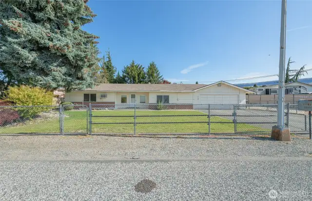 Entire .45 acre lot is fully fenced, even a rolling gate for the driveway!