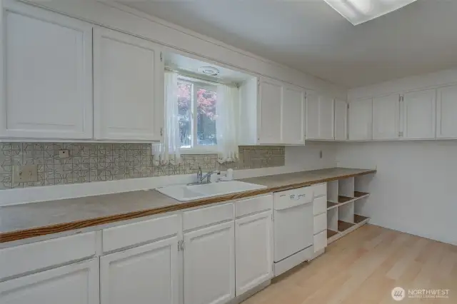 Kitchen windows faces a lovely back yard