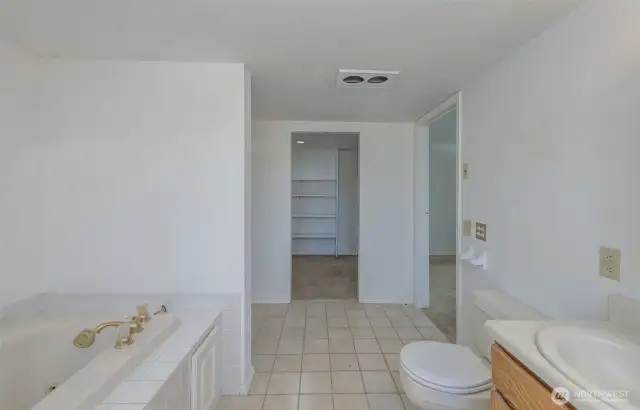 Ensuite bathroom looking toward the ample-sized walk-in closet