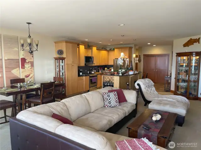Kitchen is open to the dining and living areas. Slab granite counters.
