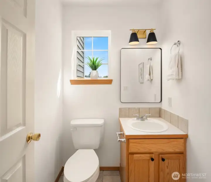 Powder room with new mirror and lights adds so much convenience for the main floor!