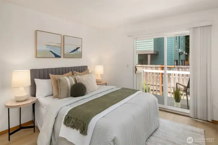Primary suite has a lovely deck overlooking the private yard.