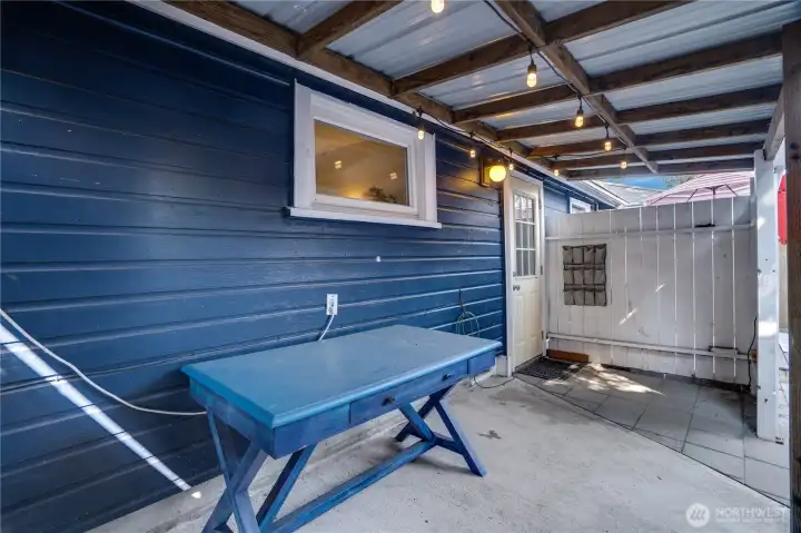 Step out the back door into your own private, enclosed retreat—perfect for relaxing, dining, or enjoying fresh air in a cozy outdoor setting.