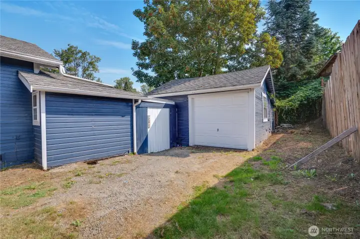 A large one-car garage and expansive driveway offer plenty of room for an RV, trailers, boats, or multiple vehicles—perfect for flexible parking and storage needs.