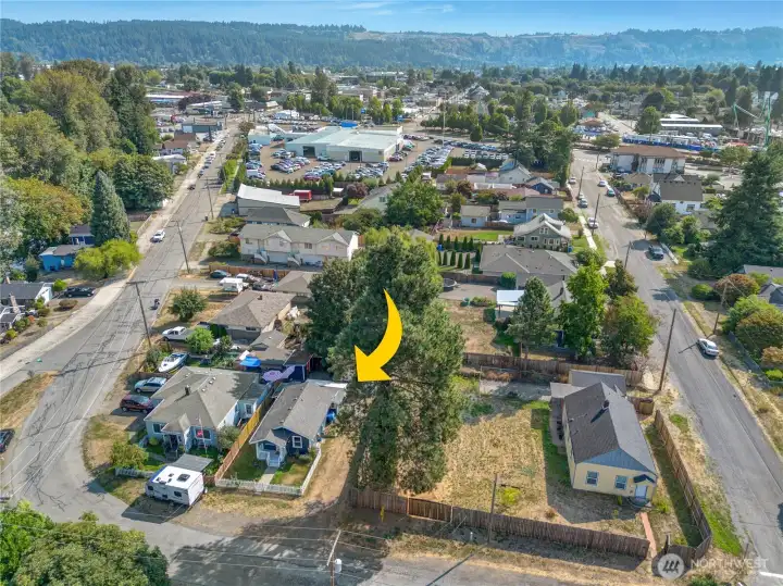 An aerial view showcases the home's unbeatable location—just moments from Sumner’s lively shops, local dining, and commuter rail access.
