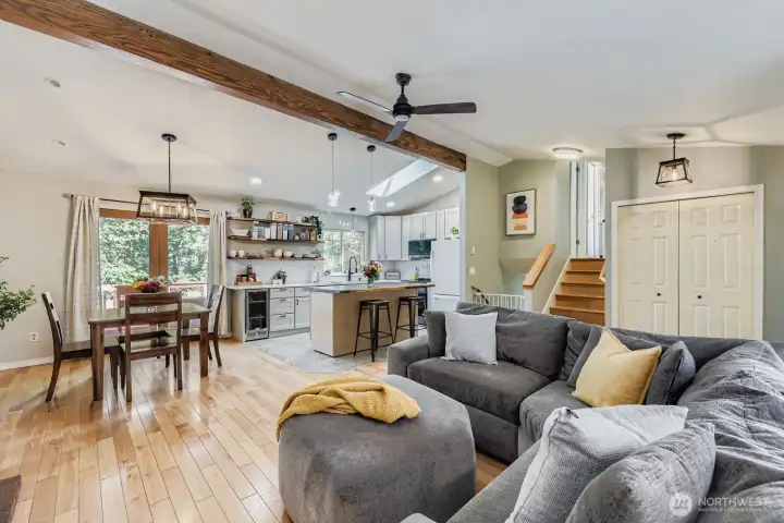Stylish open floorplan with updated kitchen, hardwoods, and deck off of dining area