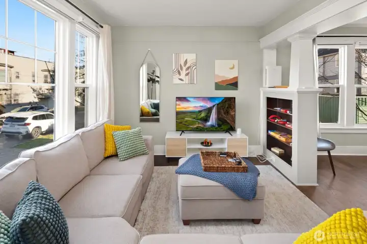 Unit #2015: the living area is light and bright, and now more energy-efficient with all new double-paned windows (complete with new motorized black-out blinds).