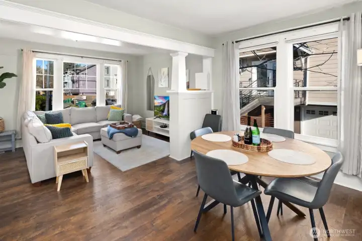 Unit #2015: Dining area flowing seamlessly back toward the living room.