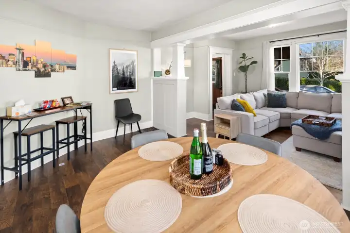 Unit #2015: Looking back toward the front entry - note the second matching built-in bookcase and columns, framing the transition between living and dining rooms.