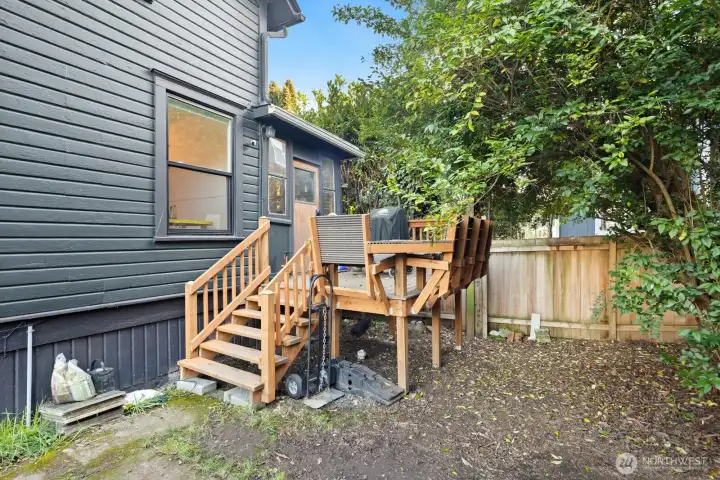 This porch off Unit #2011's kitchen was completely rebuilt and offers built-in seating and great space for a BBQ!