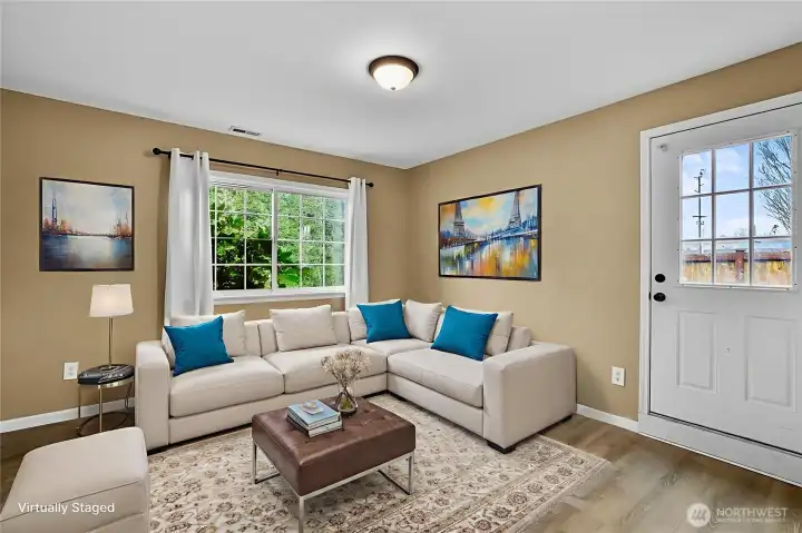 Downstairs family room has an outside entrance so could be used as an accessory dwelling unit or home office. Virtually staged.