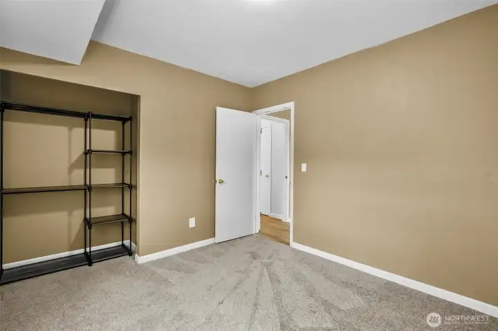 Another angle of downstairs 4th bedroom. Newer carpet.
