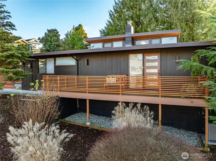 Low-slung mid-century lines, rich cedar tones, and NW greenery all around.