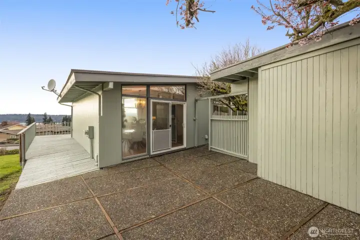 Back patio leading to the wrap-around deck