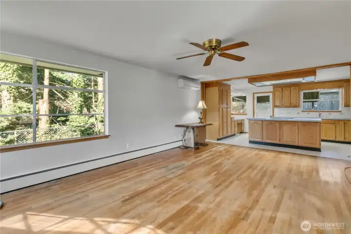 Bright, open living space with large windows and hardwood floors. The kitchen was updated in the 1980's, great for entertaining!