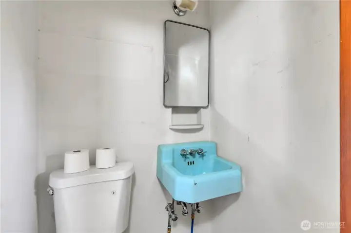 The half bathroom has the quaint vintage sink! The toilet is new.
