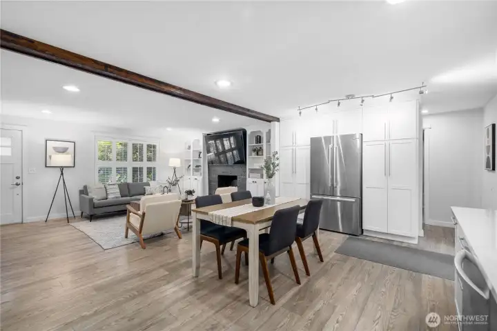 The open center of the kitchen leaves plenty of room for two cooks to move comfortably, while the easy connection to the living and dining areas keeps everyone part of the same conversation. Cooking, dining, and after-dinner relaxing flow naturally together here, making it simple to enjoy the company of family and guests while meals come together.