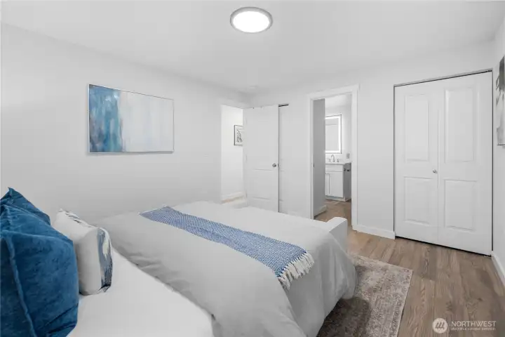 The same new luxury laminate hardwood continues here for a cohesive feel, while two large closets provide generous storage and plenty of room to stay organized.