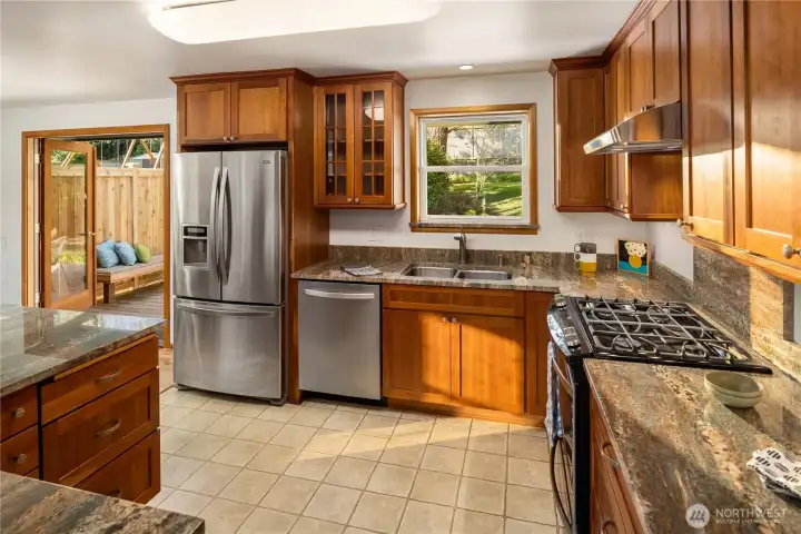 Beautiful kitchen with cherry cabinets and granite countertops.