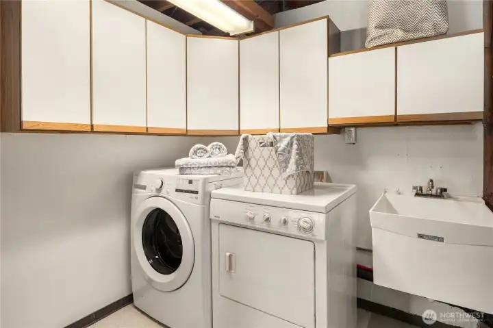 Good sized laundry with sink in basement.