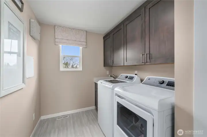 Large laundry upstairs with utility sink