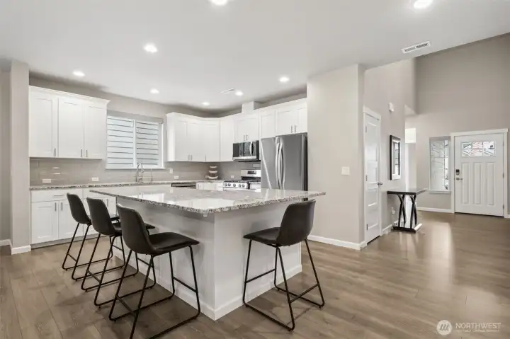 Large granite island for entertaining.