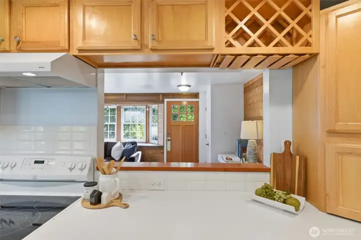 This handy window to the living room makes it a snap to pass around the appetizers and beverages. Wine storage and glass rack lets you show off your fancy barware.