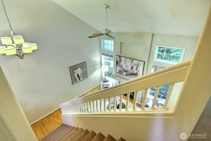 A bird's-eye view showcases the home's dramatic vaulted ceilings and light-filled living space. A bird's-eye view showcases the home's dramatic vaulted ceilings and light-filled living space.