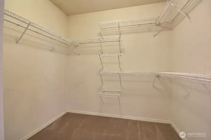 A spacious walk-in closet offers exceptional storage, thoughtful organization, and plenty of room for an expansive seasonal wardrobe. A spacious walk-in closet offers exceptional storage, thoughtful organization, and plenty of room for an expansive seasonal wardrobe.