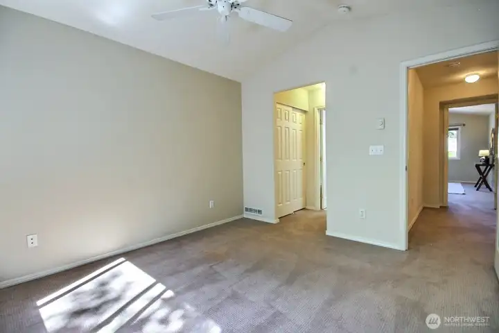 From this angle, the flow of the space is on display—entry, storage closets, and ensuite bath all seamlessly connected. From this angle, the flow of the space is on display—entry, storage closets, and ensuite bath all seamlessly connected.
