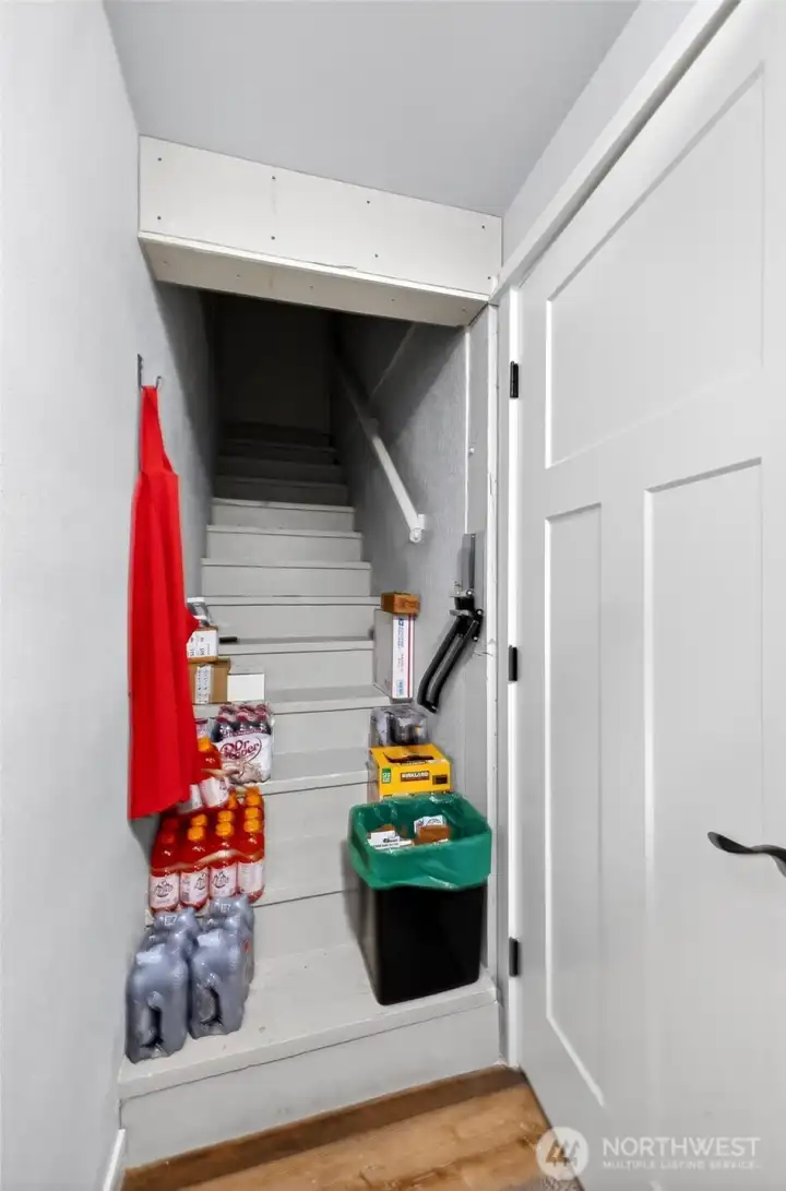 This stairway located in the pantry leads to upper unit. Just need to install a door at top.