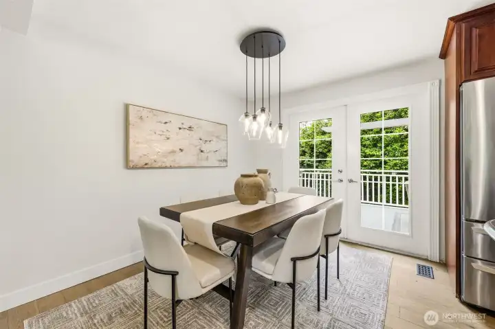 A light and airy dining space with views of the lush backyard and easy access to the deck for indoor-outdoor dining. A light and airy dining space with views of the lush backyard and easy access to the deck for indoor-outdoor dining.