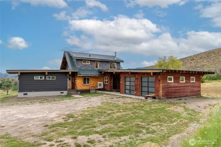 Artistic architecture by Doug Potter of Shack Architecture with attached 936 SF garage/shop.
