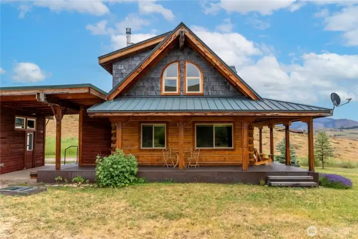 Attractive stacked-log construction, covered porch & timeless Methow Valley character.