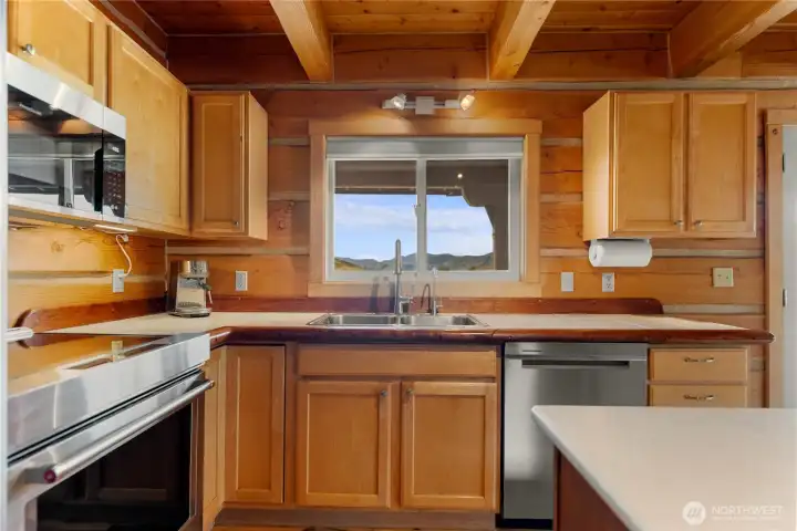 Functional kitchen with mountain views from the sink.