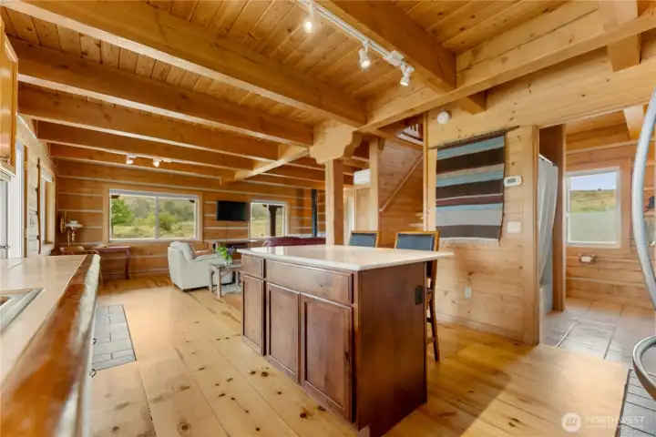 Open kitchen designed for gathering with seamless flow to dining & living areas.
